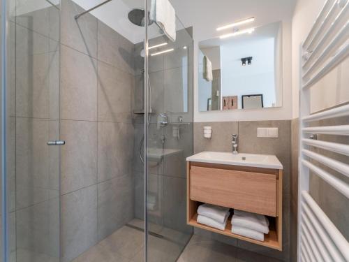a bathroom with a sink and a shower at Grebenzen Lodges 49B in Sankt Lambrecht
