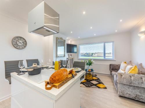 a kitchen and living room with a counter top at River View Cottage in Berwick-Upon-Tweed