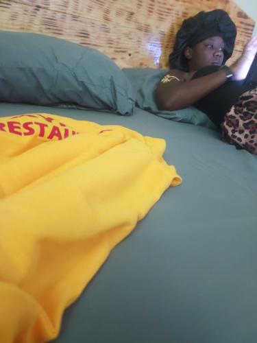 Llit o llits en una habitació de BAYO HOTEl