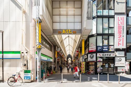a shopping mall with people walking through it at Ferio kamata III in Tokyo