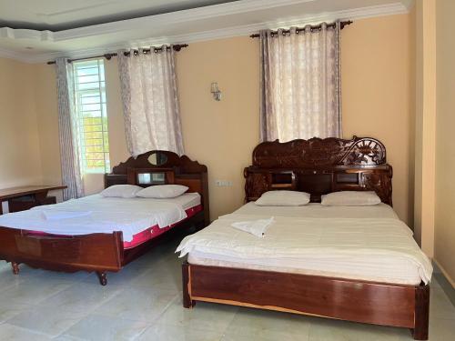 Llit o llits en una habitació de Vista Guesthouse