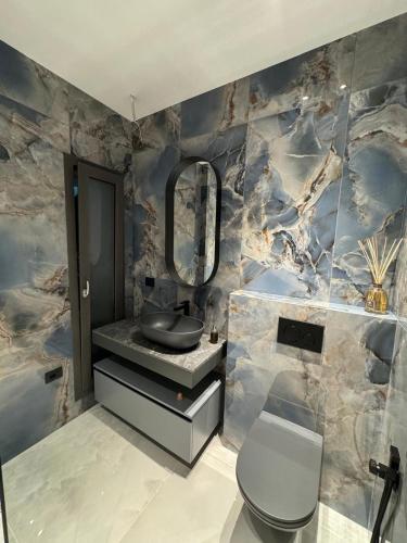 a bathroom with a sink and a mirror on a wall at Luxury Villa in Calabria in Gasponi