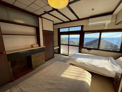 Llit o llits en una habitació de あざみ庵熱海