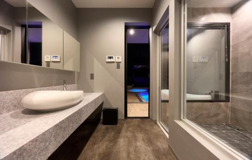 a bathroom with a white sink on a counter at Ocean Bridge - Vacation STAY 76453v in Awaji