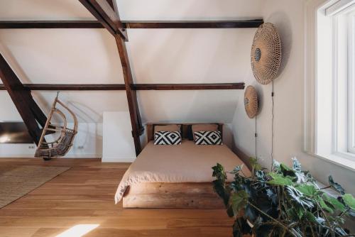 a bedroom with a bed in a room at Big loft 100m from beach in Scheveningen