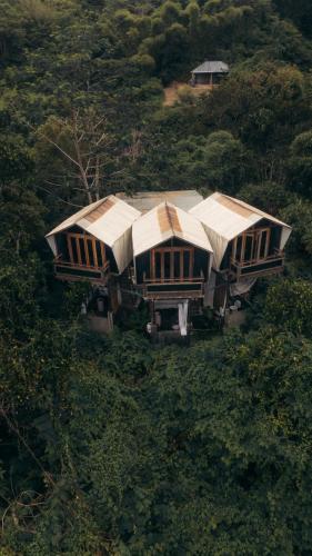 an aerial view of a house in a forest at Nirata Treehouse in Kintamani