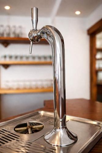 a kitchen stove with a faucet on top of it at Splendid ski-in,ski-out historical chalet! in La Lechere