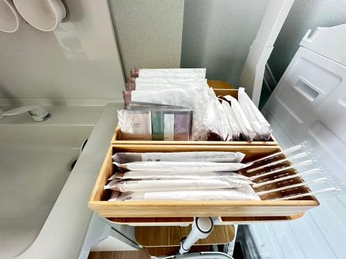 a drawer in a refrigerator filled with white items at Lapita Resort in Sakai