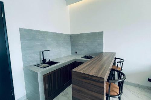 a bathroom with a sink and a counter at Alfa Jivana Resort in Sampal 2
