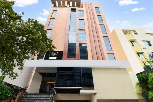 a tall building with stairs in front of it at Super Collection O Madhapur in Hyderabad