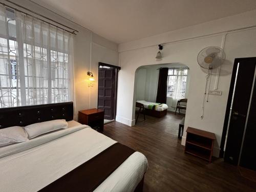 a bedroom with a large bed in a room at JKR residency in Shillong