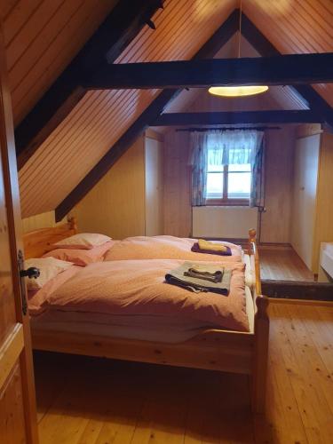 a bedroom with a bed in an attic at Haus Pfatschbacher in Wildalpen