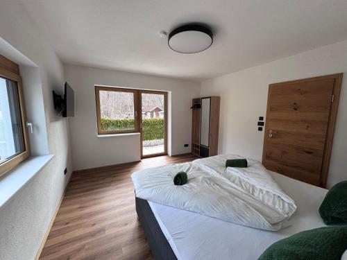 a bedroom with a large bed and a window at Alpinelodge8 in Innsbruck