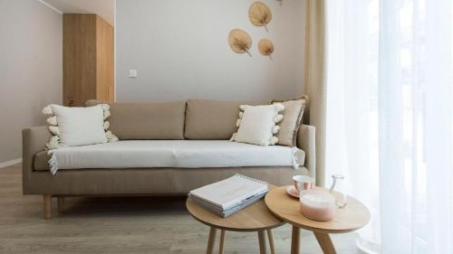 a living room with a couch and a table at Baltic Line - Pomerania in Gdańsk