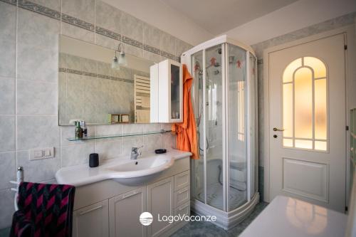 a bathroom with a sink and a shower at Appartamento Diana in Salò