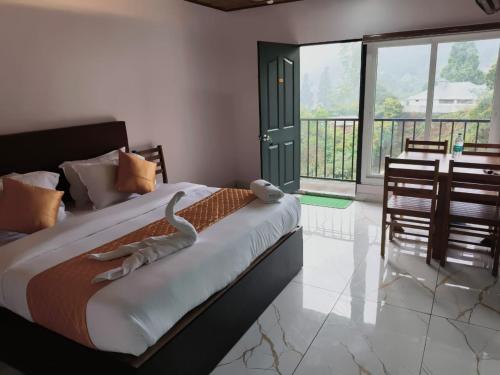 a bedroom with a bed with a snake on it at Hill view cottage cj in Devikolam