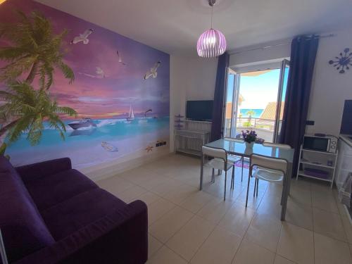 a living room with a couch and a table at Splendida Alba in Tortoreto Lido