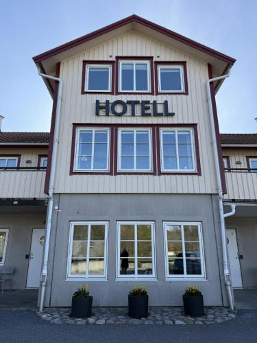 a building with a hotel sign on it at GrebbestadFjorden vandrarhem in Grebbestad