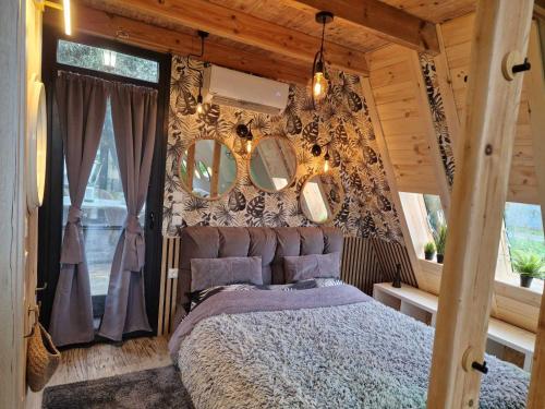 a bedroom with a bed and a wall with mirrors at DREAM house by the sea in COCOland in Epanomi