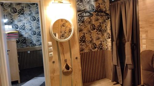 a mirror on the door of a room with a radiator at DREAM house by the sea in COCOland in Epanomi