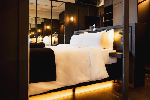 Säng eller sängar i ett rum på Block