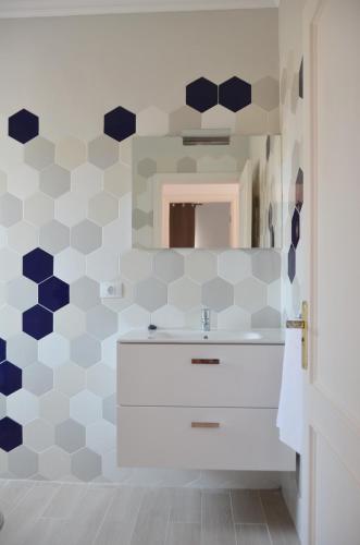 a bathroom with a white sink and a mirror at Paquita in La Laja