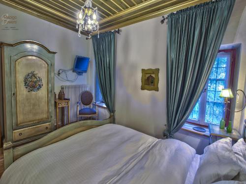 a bedroom with a large bed and a window at Papigo Towers in Papigko
