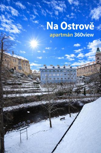 a picture of a building in the snow at Penzion na Ostrově in Český Krumlov