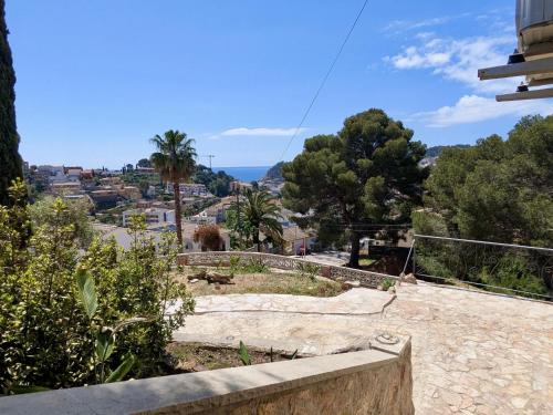 a view of a city from a hill with trees at EVH-113 Casa Martina in Tossa de Mar