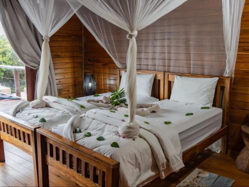 En eller flere senge i et værelse på Chicuanga