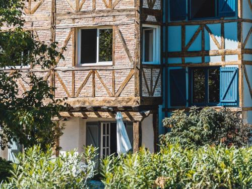 a blue and white building with a balcony at Hotel Zubieta in Lekeitio