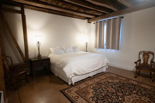 a bedroom with a white bed and a window at New Field Farm at Timber Ridge in Lexington