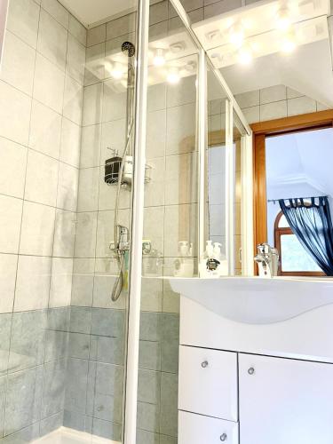 a bathroom with a shower and a sink at Mountain View House - Panoramic! in Gozd Martuljek