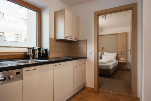 a kitchen with a sink and a toilet in a room at Haus Kristall inkl der SUPER SOMMER CARD im SOMMER 2026 in Serfaus