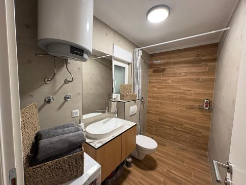 a bathroom with a sink and a toilet at Villa Marija in Livno