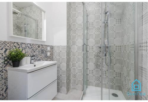 a bathroom with a shower with a toilet and a sink at Sunlight Room - 15 min to Old Town Gdansk in Gdańsk