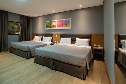 a hotel room with two beds in a room at Zagaia Eco Resort in Bonito