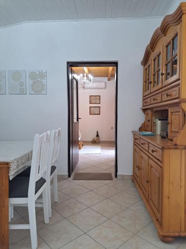 a kitchen with a table and a dining room at Piknik Garden in Senta
