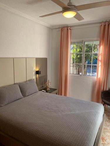 a bedroom with a bed and a window at Angeleyes in San Pedro del Pinatar