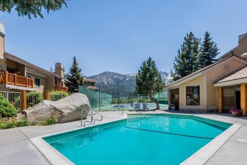 a swimming pool in front of a house at Mammoth Creek Unit 15 in Mammoth Lakes