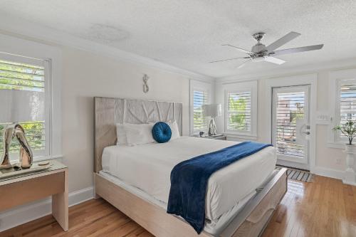 a bedroom with a bed and a ceiling fan at Harbor On Holiday Isle in Destin