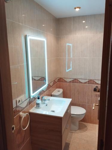 a bathroom with a sink and a toilet at Apartamento Maru's in Oropesa del Mar