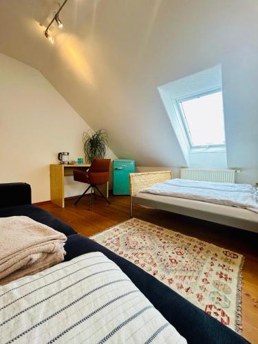 a bedroom with two beds and a window at Gästezimmer Traisen in Traisen