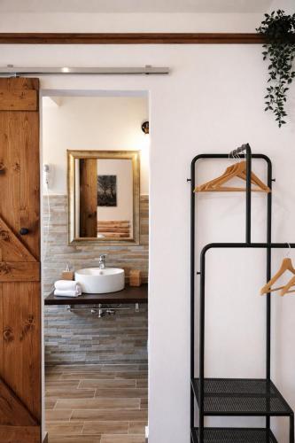a bathroom with a sink and a mirror at Villa Corocael in Castellabate