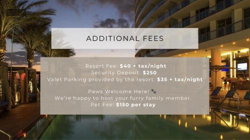a sign in front of a building with a pool at PRICE REDUCED DUE TO FLOOR COSMETIC DAMAGE - Picturesque Beachfront Condo - LOVELY 2BD and 2BA APT WITH DIRECT OCEAN VIEW in Hollywood
