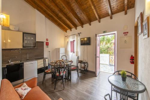 a living room with a couch and a table at C14 - Casa da Luz in Luz