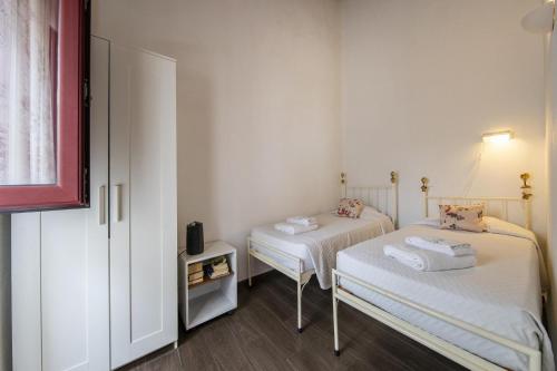 a room with two beds in a room at C14 - Casa da Luz in Luz