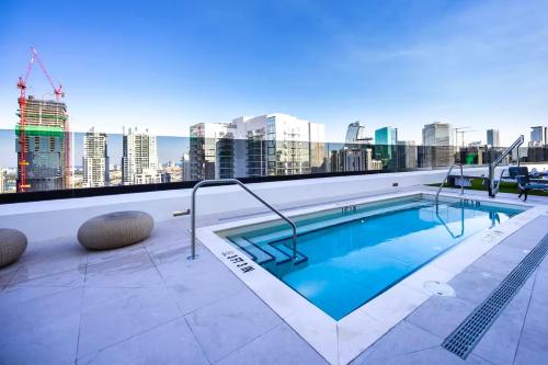 a swimming pool on the roof of a building at District 225 in Miami