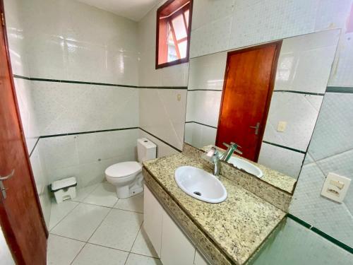 a bathroom with a sink and a toilet at Casa Centro do Rio in Rio de Janeiro