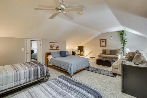 a bedroom with a bed and a couch at Pool & Beach Access: Lake of the Ozarks Condo in Osage Beach